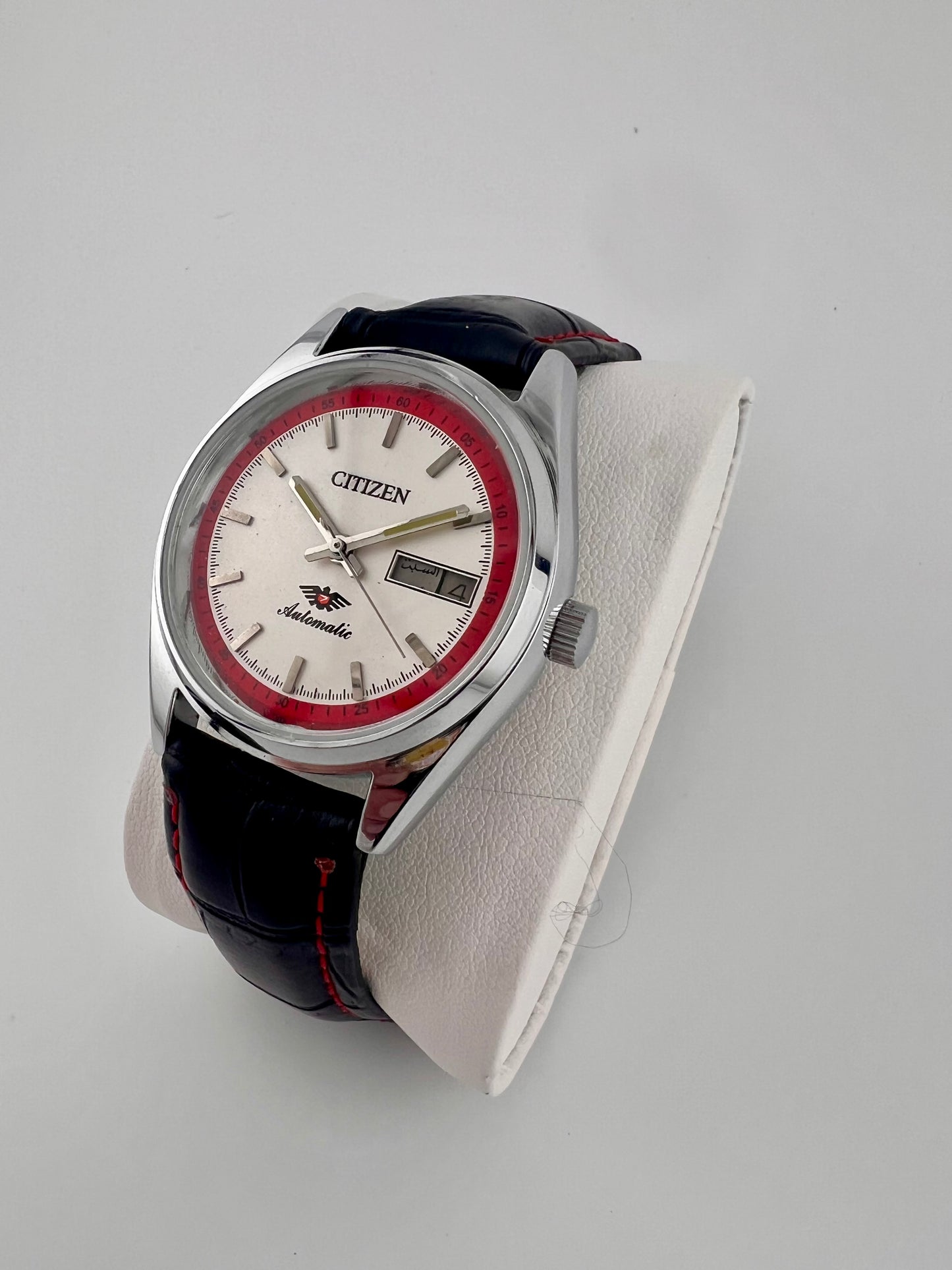 Vintage Citizen automatic white red day-date watch — side shot — PAWL Studio
