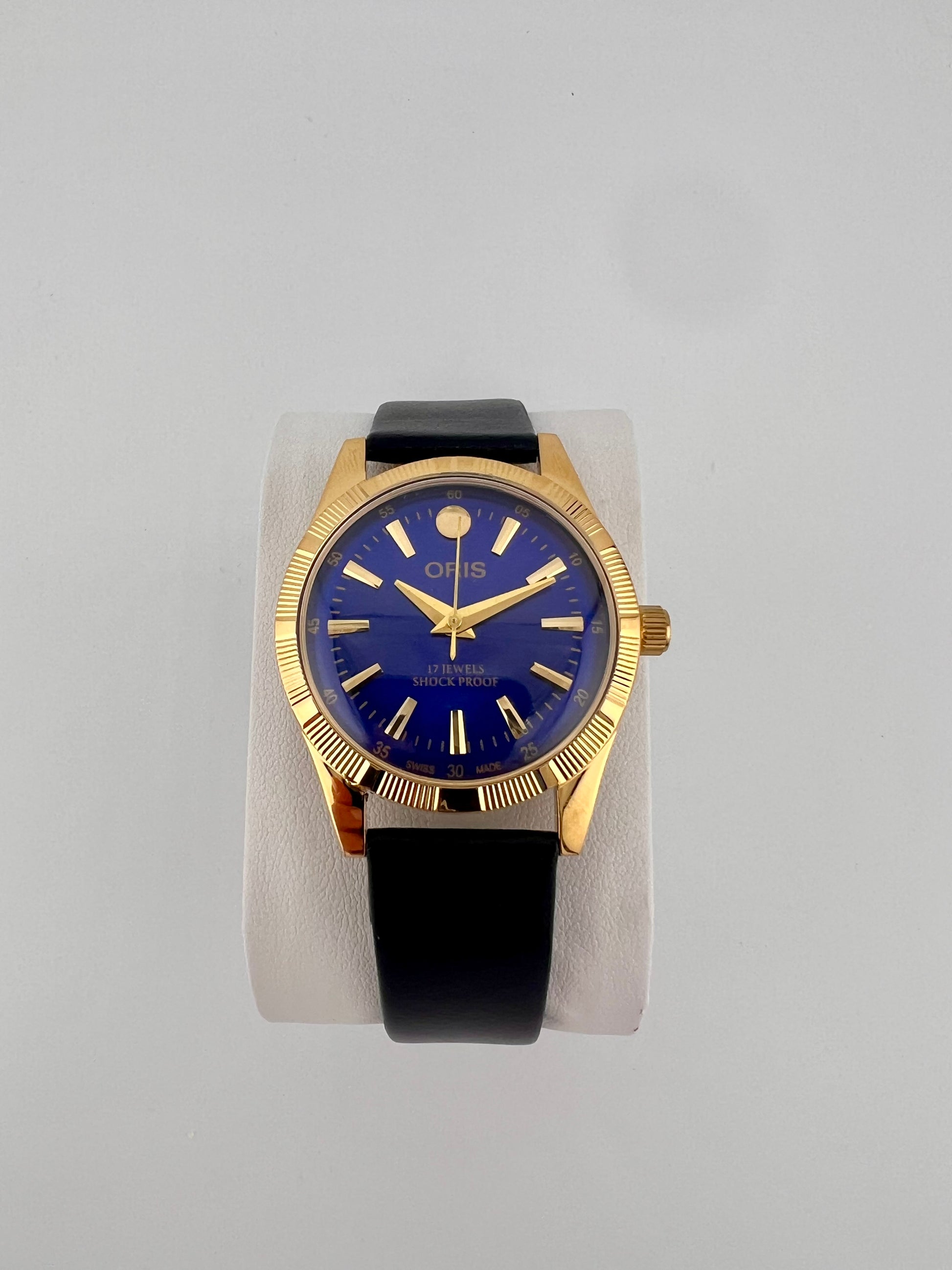 Vintage Oris blue gold dial Swiss watch — life shot — PAWL Studio