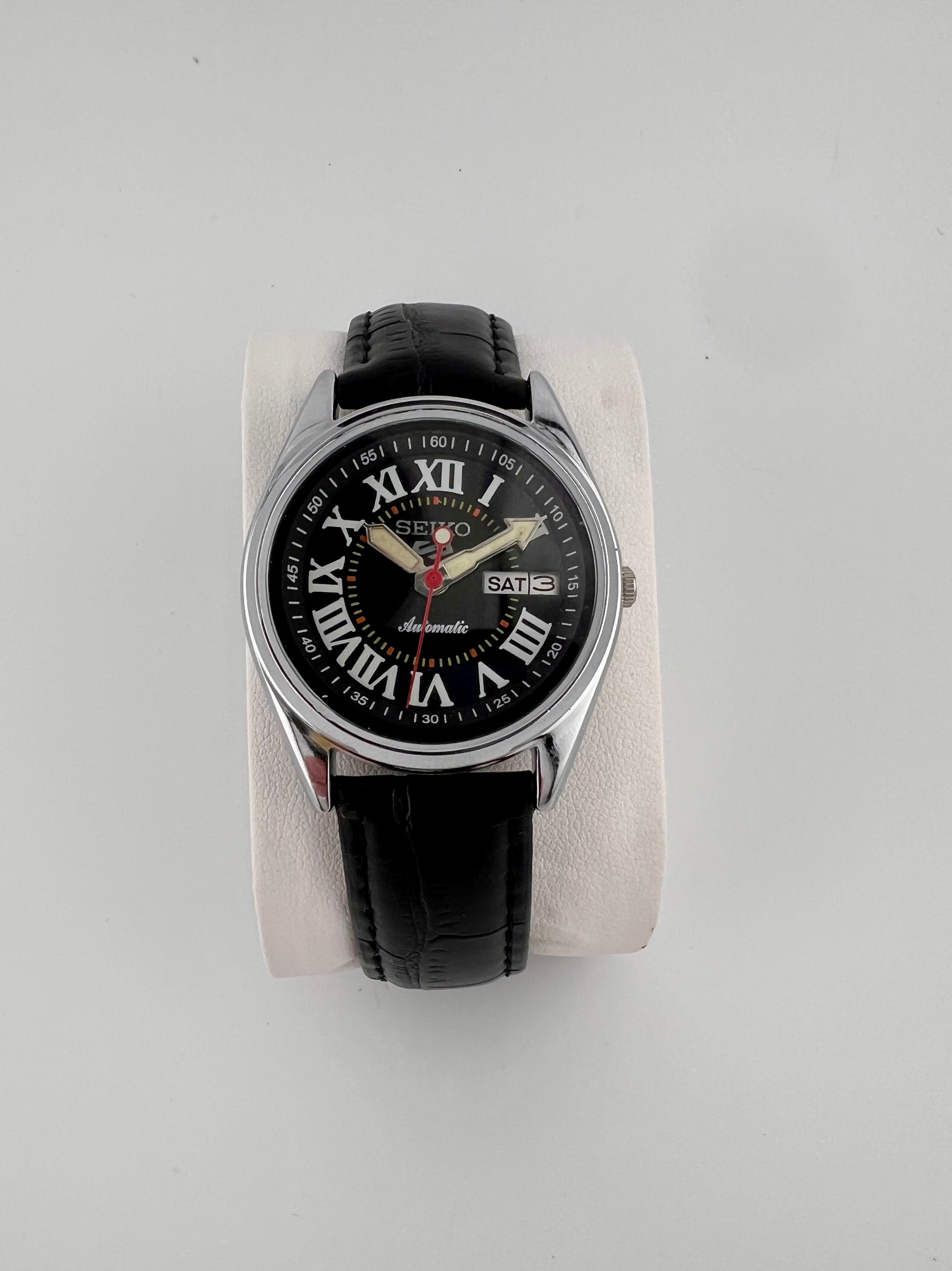 Vintage Seiko black Roman dial watch — life shot — PAWL Studio