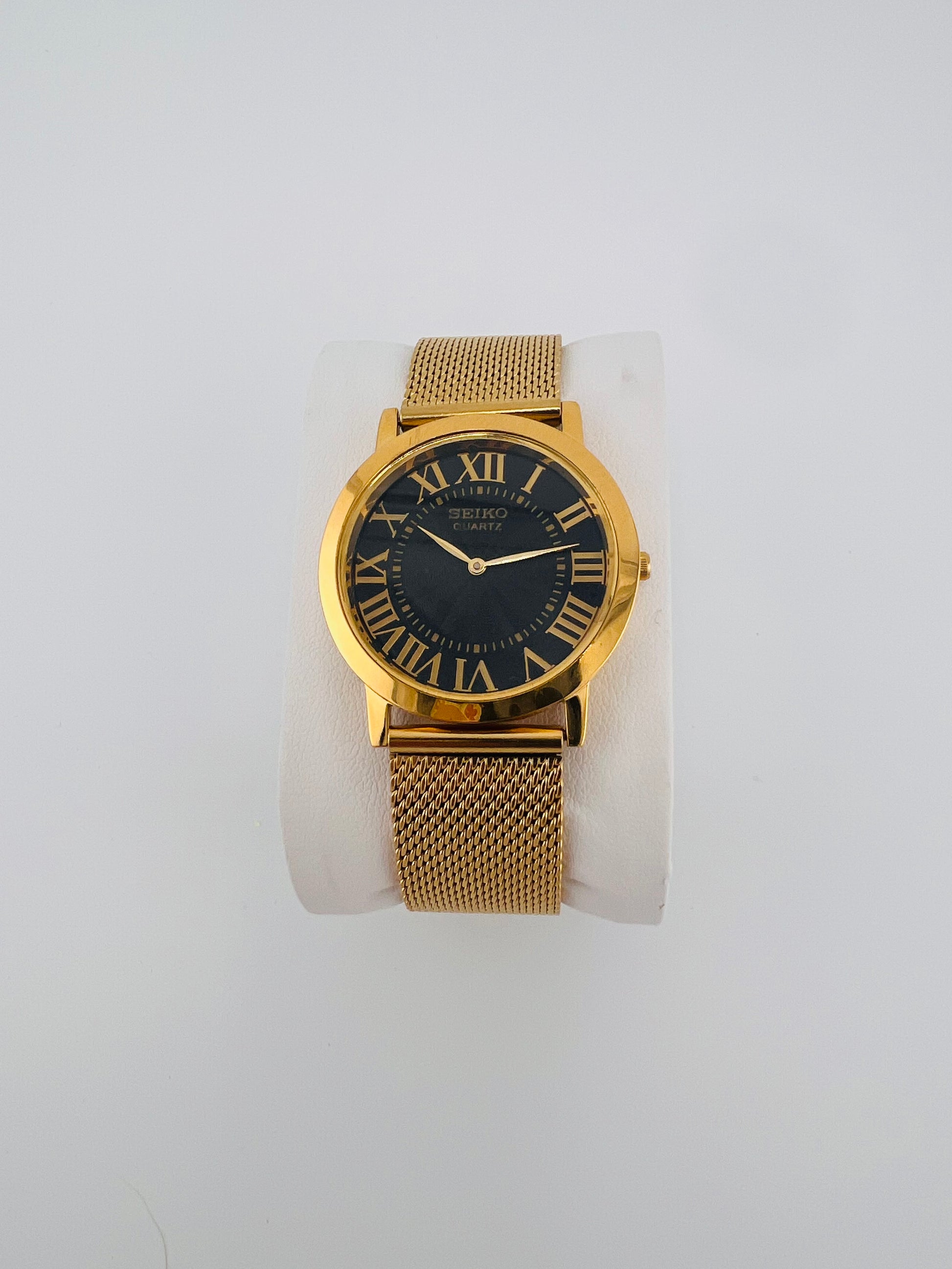 Vintage Seiko quartz black Roman dial watch — life shot — PAWL Studio